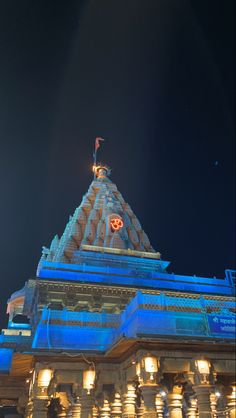 an ornate building lit up with blue lights