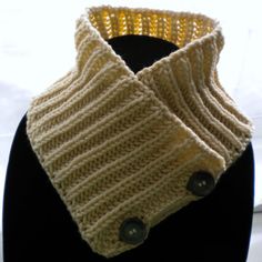 a close up of a knitted collar on a mannequin