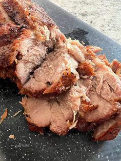 sliced meat sitting on top of a cutting board