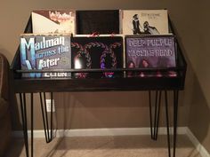 a table with some books on it and two hairpin legs in front of it