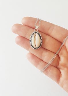 "A Sterling silver Cowrie Pendant - The prefect necklace for your bohemian looks ! *It has been made from scratch by me using sterling silver sheet and wire. *Finished with a black patina and brought to a shine. * 18\" Long -Hanging from a sterling silver chain . *You can find the matching ring here: https://www.etsy.com/listing/676737408/sterling-silver-cowrie-shell-ring-sea?ref=shop_home_active_2&frs=1 *This necklace is made to order.Please up to 1 week to have it ready for you.It will com Cowrie Shell Necklace, Shell Ring, Matching Ring, Rose Quartz Ring, Boho Pendant, Bohemian Beach, Bohemian Rings, Summer Necklace, Cowrie Shell