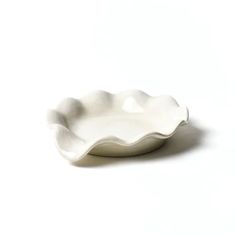 a white bowl sitting on top of a table