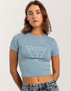 Guess Originals Vintage Triangle Baby Tee. Triangle Baby Tee. Signature Logo Print At Front. Crew Neckline. Cropped Length. Short Sleeves. 50% Organic Cotton, 45% Cotton, 5% Elastane. Machine Wash. Imported, Model Is Wearing A Size Small. Model Measurements:height: 5'8" Bust: 34"waist: 25"hips: 37.5" Fitted Blue Tops With Logo Print, Guess Originals, Top Graphic Tees, Guess Jeans, Signature Logo, Baby Tee, Infant Tees, Model Measurements, Logo Print