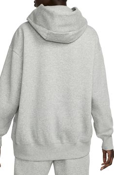 Exaggerated features like an oversized kangaroo pocket and extra tall ribbing add to the roomy feel of this sporty hoodie with a cozy brushed fleece interior. Drawstring hood 80% cotton, 20% polyester Machine wash, dry flat Imported Oversized Hooded Sports Sweats, Oversized Hooded Sweats For Sports, Oversized Hooded Hoodie For Sportswear, Oversized Hooded Sportswear Hoodie, Oversized Hooded Hoodie Sportswear, Nike Hoodie With Kangaroo Pocket For Streetwear, Oversized Sportswear Hoodie With Double-lined Hood, Nike Winter Hoodie With Kangaroo Pocket, Nike Hooded Hoodie