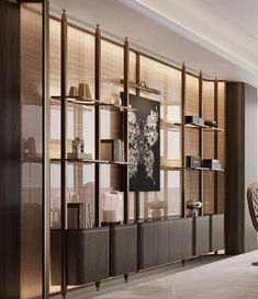 a living room filled with furniture next to a window covered in bamboo blinds and shades