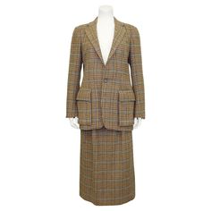 Classically preppy Ralph Lauren suit from the 1990s. Tan wool mini houndstooth with contrasting brown, navy, teal and caramel throughout. Hacking jacket features a notched collar, two button closure, four mini buttons at cuffs, a horizontal slit pocket at the bust and oversized flap pockets at hips. Skirt is a classic high waisted with inverted pleats and diagonal slit pockets. Fastens with a centre seam zipper, belt Ioop and two buttons on the right hip. Very smart worn together, but both piece Ralph Lauren Skirt, Hacking Jacket, Jacket And Skirt Set, Ralph Lauren Suits, Givenchy Couture, Designer Ralph Lauren, Ralph Lauren Skirts, Peplum Jacket, Lauren Brown