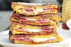 a stack of french toast with ham and cheese