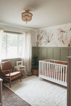 a baby's room with a crib and chair