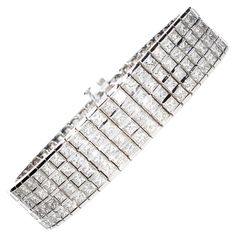 Semi-rigid bracelet with 204 princess cut diamonds total weight about 20.00 ct. The bracelet is made up of 4 rows of princess cut diamonds, each diamond is set between two white gold rails. The bracelet has a retractable closure and also an additional safety closure in the part below the bracelet. The bracelet is in 18 kt white gold and is handmade. •Diamond Cuts: Princesse •Total Number of Diamonds: N° 204 •Total Caratura Diamonds: Ct 20.00 (Approximately) •Weight Grams: gr 50 •Bracelet Length: Rectangular Diamond Cut Tennis Bracelet, Rectangular Diamond Cut Bracelet For Wedding, Rectangular Diamond Cut Wedding Bracelet, Rectangular Diamond Bracelet With Diamond Accents, Luxury Princess Cut Diamond Bracelet For Formal Occasions, Princess Cut Diamond Bracelet For Wedding, Rectangular Diamond Bracelet With Jubilee Design, Rectangular Diamond Cut Wedding Bracelets, Formal Cubic Zirconia Princess Cut Bracelets