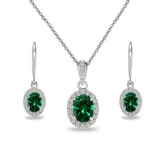 This stunning jewelry set includes dangling leverback earrings featuring 7x5mm oval simulated emerald gemstones set in a halo setting with surrounding white topaz stones and a pendant necklace featuring an oval 8x6mm simulated emerald gemstone with the bale showcasing white topaz gemstones for an added touch. The set is entirely crafted of fine sterling silver, nickel & tarnish free. The earrings are secured by leverbacks and the necklace secures with a spring-ring clasp. The necklace includ Birthstones Jewelry, Birthstones Meanings, Birthstone Rings, Halo Necklace, Cartilage Earrings Hoop, Stones Jewelry, Birthstone Colors, Ring Birthstone, Birthstone Bracelet