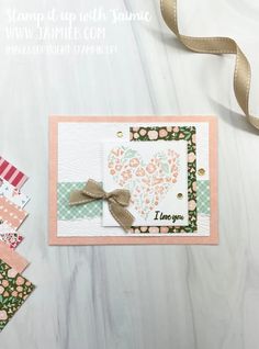 a close up of a card on a table with some ribbon and other crafting supplies