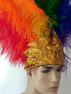 We make and ship our items really fast if you need it for a specific date please let us know. or call/text us at 954-3051817 to complete your order over the phoneRainbow Pride Prime Ostrich Wing Plumes Feather Carnival Headdress Showgirl  on a Custom Tiara/crownWe only use the best quality of ostrich wing feathers. Each feathers is approximately 20" tall.The crown is completely hand beaded in sequined and acrylic beads.Feathers are a natural product therefore a slight variation in texture, color Carnival Crown Headpiece For Mardi Gras, Mardi Gras Carnival Crown Headpiece, Crown Headpiece For Mardi Gras Carnival, Carnival Round Crown Headpieces For Costume Party, Carnival Costume Party Headpiece With Round Crown, Round Crown Headpiece For Carnival Costume Party, Tall Crown Costume Accessories For Carnival, Costume Accessories With Tall Crown For Carnival, Adjustable Costume Hats And Headpieces For Carnival