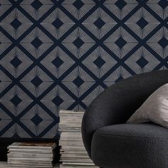 Add luxury and glamour to your walls with Deco Triangle Navy wallpaper. This glamorous wallpaper design features a maxi geometric triangle pattern in statement silver metallic on a deep navy blue background. This luxurious statement design is printed on a fibrous paper that adds subtle texture and dimension to any living space. Graham & Brown 11-in Navy Blue Non-woven Textured Geometric 56-sq ft Unpasted Paste The Wall Wallpaper Sample | 11827294 Glamorous Wallpaper, Graham Brown, Navy Wallpaper, Deep Navy Blue, Graham & Brown, Navy Blue Background, Geometric Triangle, Triangle Pattern, Good House