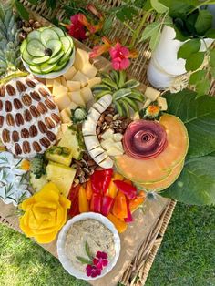 a table topped with lots of different types of fruit and veggies on top of it