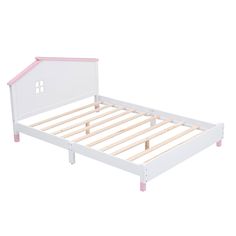 a white bed with pink trim and wooden slats