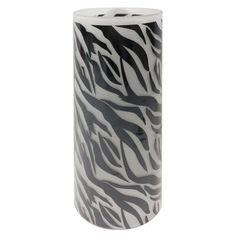 a black and white vase with zebra print on it's sides, sitting in front of a white background