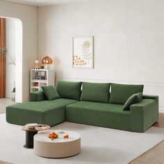 a living room with a green couch and white rug