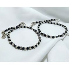 Product - AAA Silver Oxidize Black Bead Anklet Material - German Silver, Oxidize, Beads  Bead Color - Black  Closure - Hook  Anklet Length - 10 Inches  Anklet Weight - 20.5 Gm ( Single) Anklet Weight - 9.5 Gm (Pair) Anklet Type - Adjustable  Free Standard Shipping Worldwide! Elegant Black Beaded Anklets, Payal Designs Silver, Anklets Silver, Boho Bangle Bracelets, Silver Anklets Designs, Bead Anklet, Silver Ankle Bracelet, Silver Cuff Bangle, Vintage Wedding Jewelry