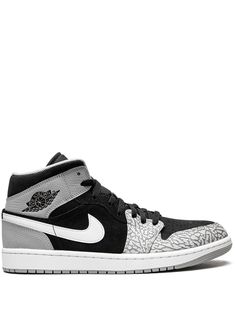 Air Jordan 1 Mid SE sneakers from JORDAN featuring black, grey, white, leather, signature Swoosh logo detail, signature Air Jordan Wings logo, contrasting panel detail, round toe, front lace-up fastening, logo patch at the tongue, branded insole and rubber sole. These styles are supplied by a premium sneaker marketplace. Stocking only the most sought-after footwear, they source and curate some of the most hard to find sneakers from around the world.. | Jordan Mid SE sneakers Jordan 1 Elephant Toe, Jordan 1 Elephant, White Forces, Jordan Wings, Jordan Mid, Air Jordan 1 Mid Se, Wings Logo, Print Sneakers, Swoosh Logo