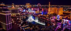 the las vegas strip is lit up at night and has an image of fountains in the water