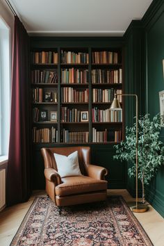 a chair in front of a book shelf with books on it and a lamp next to it