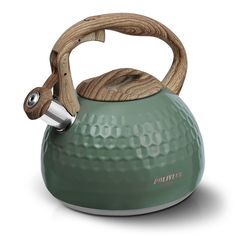 a green tea kettle with a wooden handle