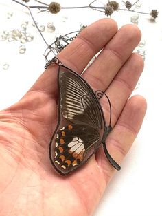 It is handcrafted exclusive design pendant made with glass and real butterfly wings. Each of our pendants can not be repeated exactly. The pendant can be worn on both sides. It will be nice anniversary gift. All jewelry comes in a cardboard box ready to be gift wrapped. And other unique jewelry here https://www.etsy.com/shop/RosavaGlassStore We accept only PayPal. Item is ready to ship, we will send it within 1-3 bussines days after payment confirmation. We do not ship on Saturdays and Sundays. Black Butterfly-shaped Jewelry For Gift, Black Butterfly Jewelry For Gift, Butterfly Pendant Necklace As A Gift, Butterfly Pendant Necklace For Gifts, Butterfly Pendant Necklace For Gift, Black Butterfly Necklace For Gift, Butterfly Shaped Necklace With Large Pendant, Wing-shaped Black Jewelry Gift, Black Wing-shaped Jewelry Gift