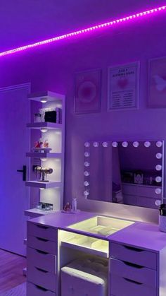 a bedroom with purple lighting and white furniture