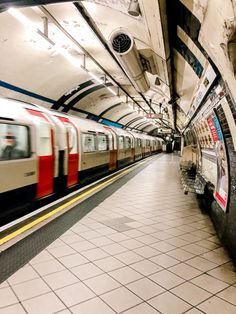 a subway train traveling through a subway station