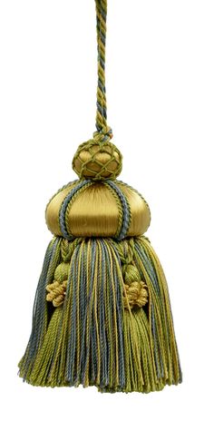 a green and blue tasselle hanging from a rope