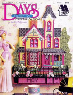 an image of a magazine cover with a woman in front of a doll's house