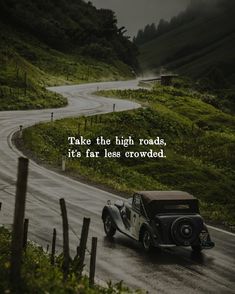 an old car driving down a road with a quote on the side that says, take the high roads, it's far less crowded