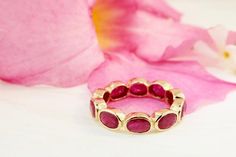 Eternity Ring with oval-shaped ruby bezel set horizontally.The 18K yellow gold is hand polished to get the smooth and refined look. The band is approximately 5 mm wide.Metal: 18K Yellow GoldGemstones: RubyTotal weight: 4.65 caratsThis ring cannot be resized.Available in 5-8 US ring size in full, and half sizes. If you need a smaller or larger size, please contact us.___________________________________________ALTERATIONS & CUSTOMOur jewelry is made to order and may be customized upon request (ie, Classic Oval Stackable Ruby Ring, Stackable Oval Ruby Ring In Fine Jewelry, Classic Oval Ruby Ring Stackable, Fine Jewelry Stackable Oval Ruby Ring, Oval Stackable Ruby Ring For Anniversary, Oval Ruby Stackable Ring For Anniversary, Oval Ruby Ring Stackable For Formal Occasions, Anniversary Oval Ruby Stackable Ring, Anniversary Stackable Oval Ruby Ring