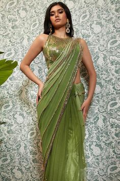 Shaded moss green pre-stitched saree crafted from georgette base, features net pleats, sequins, and golden beaded embroidery. Comes with a matching halter padded blouse featuring delicate embroidery work.  Components: 2 Pattern: Embellished Type Of Work: Sequins, beads Neckline: Round Sleeve Type: Sleeveless Fabric: Georgette, Tulle Color: Green Other Details:  Striped pattern work Occasion: Destination Wedding - Aza Fashions Papa Don't Preach, Stitched Saree, Padded Blouse, Drape Saree, Delicate Embroidery, Green Saree, Beaded Neckline, Green Sequins, Blouse For Women