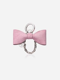 a pink bow tie keychain is shown with a metal ring on the end