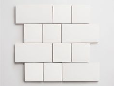 several white square tiles arranged on top of each other