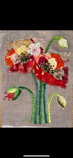 a piece of cloth with flowers painted on it