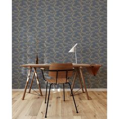 two wooden desks in front of a wallpapered background