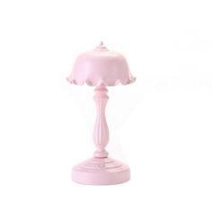 a pink table lamp on a white background