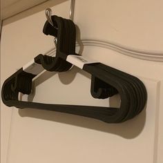 a pair of black and white scissors hanging from a hook