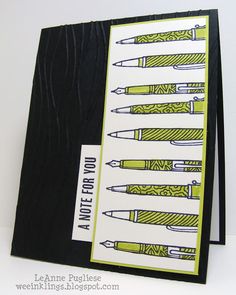 a close up of a greeting card with pens on the front and back of it