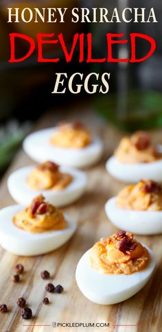 deviled eggs on a cutting board with text overlay that reads honey sriraca deviled eggs