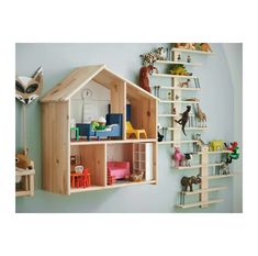 a wooden doll house with toys on shelves