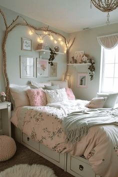 a bedroom decorated in pink and white with lots of lights