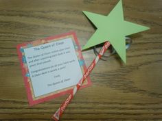 a paper star next to a candy cane on top of a wooden table with a poem about the queen of cream