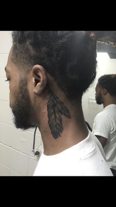 a man with a tattoo on his neck