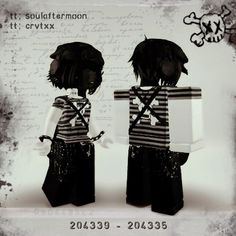 two dolls are standing next to each other in front of a piece of paper with writing on it