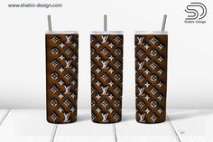 two brown tumblers with louis vuitti designs on them