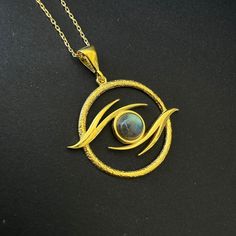 Labradorite Eye of Ra Necklace, 925 Sterling Silver Witchy Evil Eye Pendant, Labradorite Gothic Eye Amulet Necklace, Moonstone Eye Talisman 𓂀 Modern Minimalist Eye of Ra Necklace  𓂀 The Eye of Horus, an ancient Egyptian symbol, embodies protection, royal power, and good health.  Its mystic allure lies in its role as a potent amulet, transcending millennia to evoke a timeless emblem of divine safeguarding and prosperity. Item Details, ✔️ Made of certified 925 sterling silver ✔️ 14k Gold Plated Moon Charm Labradorite Jewelry, Labradorite Jewelry With Moon Charm, Labradorite Moon Charm Jewelry For Healing, Round Labradorite Jewelry With Moon Charm, Gold Labradorite Jewelry With Moon Charm, Labradorite Moon Phase Round Necklace, Round Labradorite Moon Phase Necklace, Gold Jewelry With Moon Charm And Labradorite, Gold Jewelry With Labradorite Moon Charm