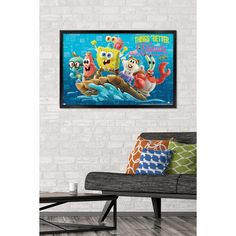 an image of spongebob and friends in the water on a wall above a couch